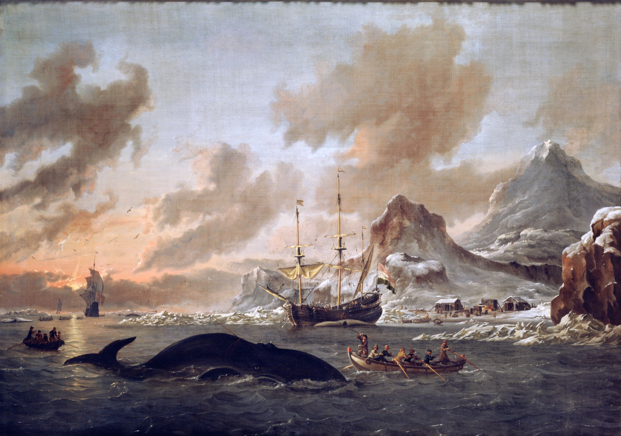 Abraham Storck's 1690 painting of Dutch whalers near Spitsbergen: a whale surfaces beside harpoon boats while a Dutch ship lies in the Arctic ice at sunset, a shore station rendering blubber into oil.